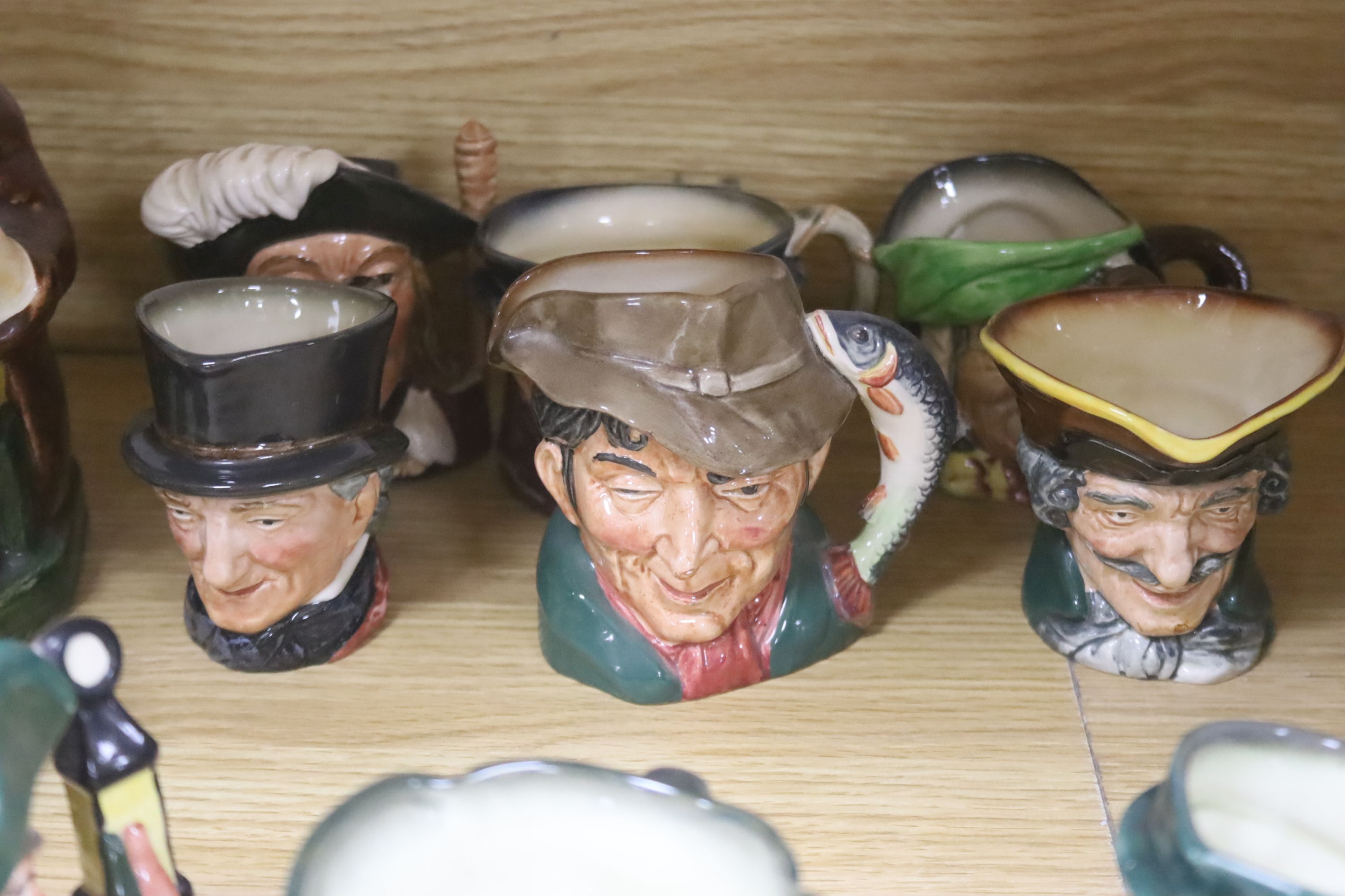 Twelve Royal Doulton character 'small' mugs and two Toby jugs